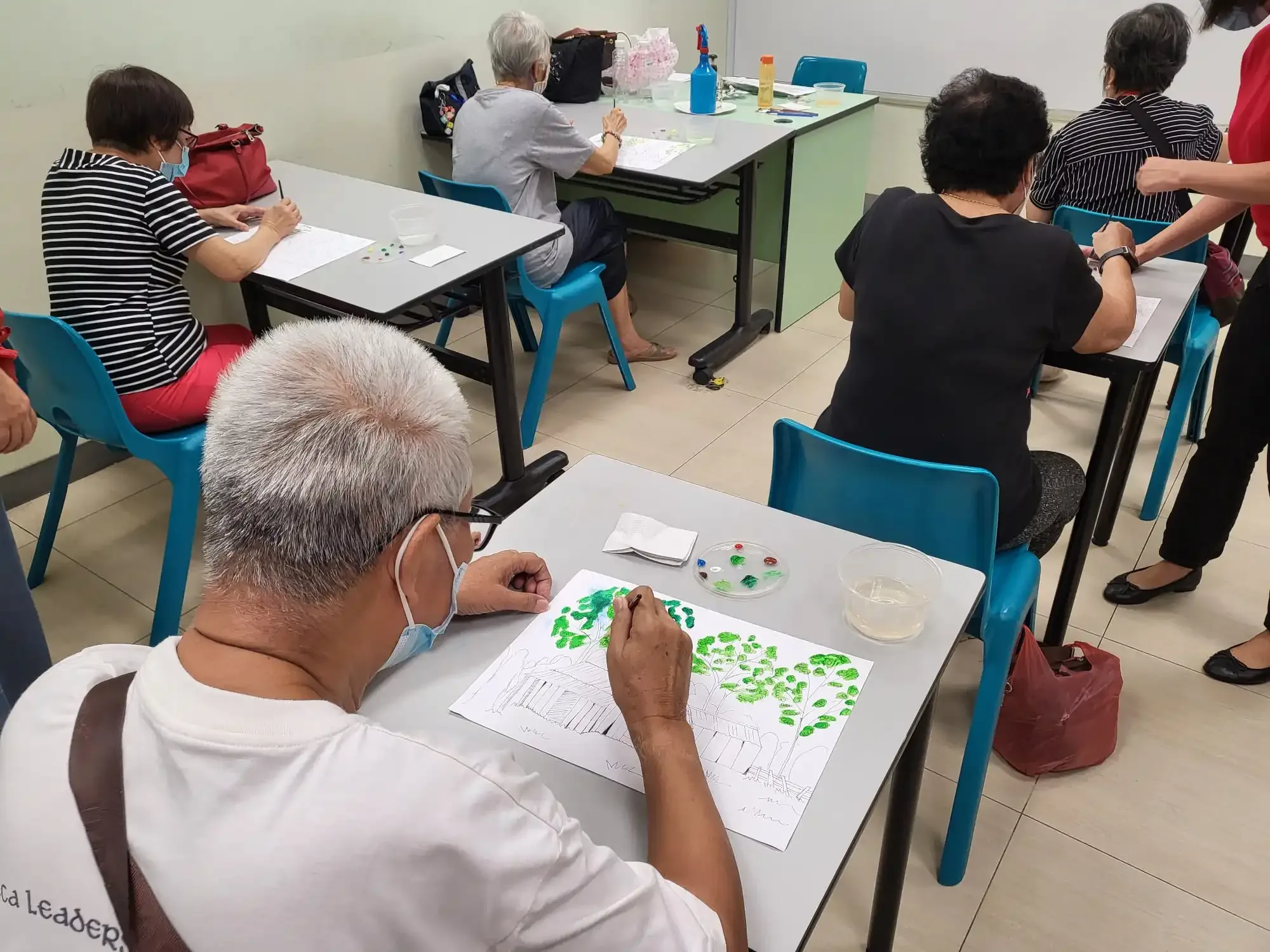 Seniors participating in mind games and fun activities at CDAC Tampines