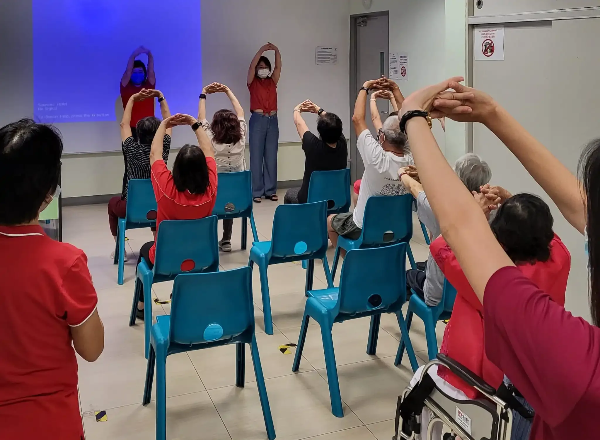 Seniors enjoying the watercolour painting activity after the Laughter Yoga session