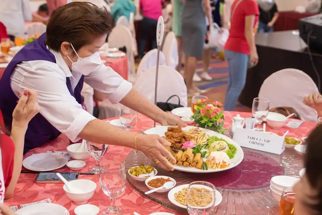Residents and children enjoying the catered lunch at Qian Xi restaurant