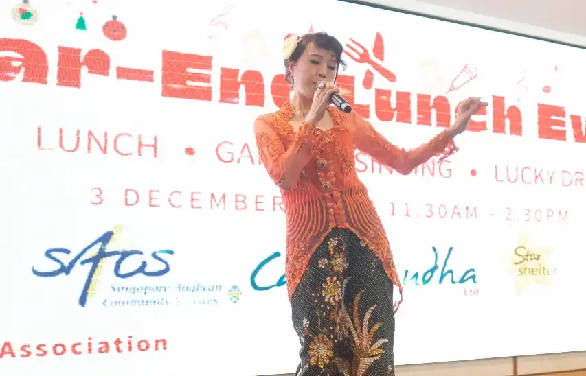 Jojoe and Benson performing in Indian costumes during the entertainment segment