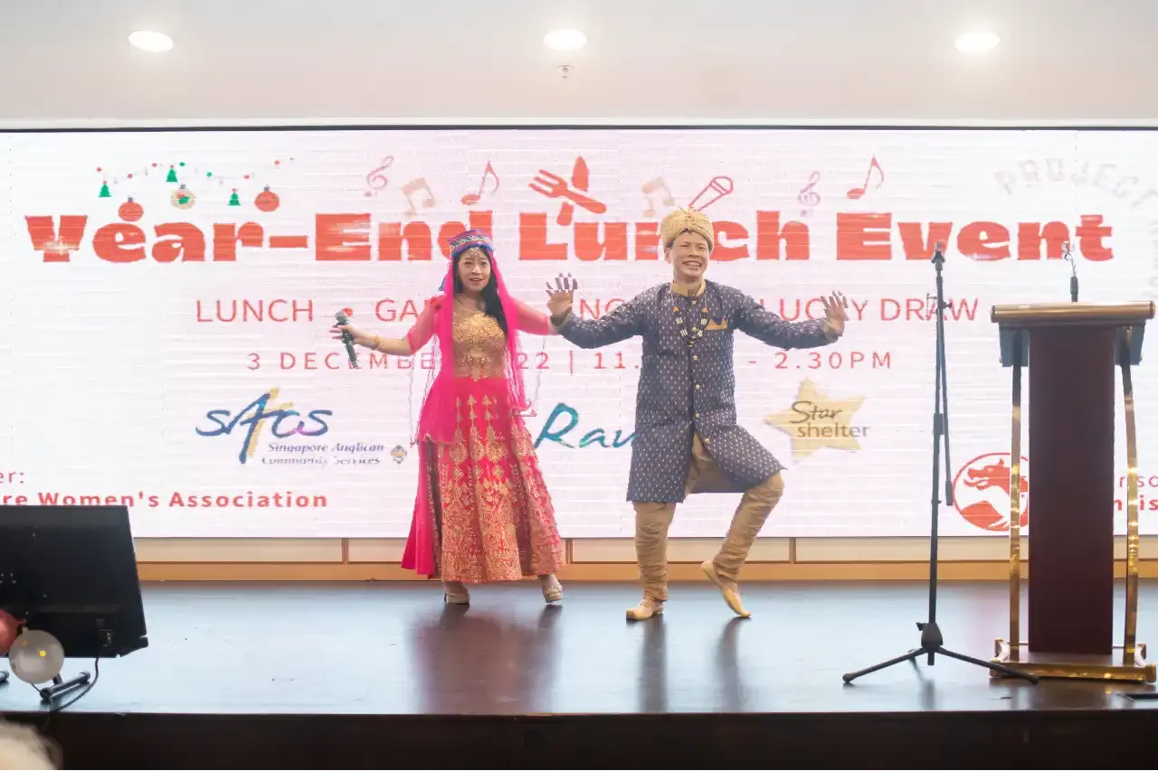 James Poh and Rita performing 'Top of the World' for the guests