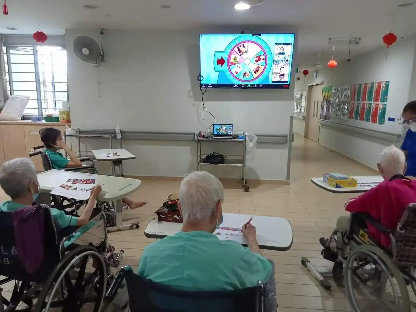 Roxanne Zhang hosting the Wheel of Fortune game with Ren Ci residents