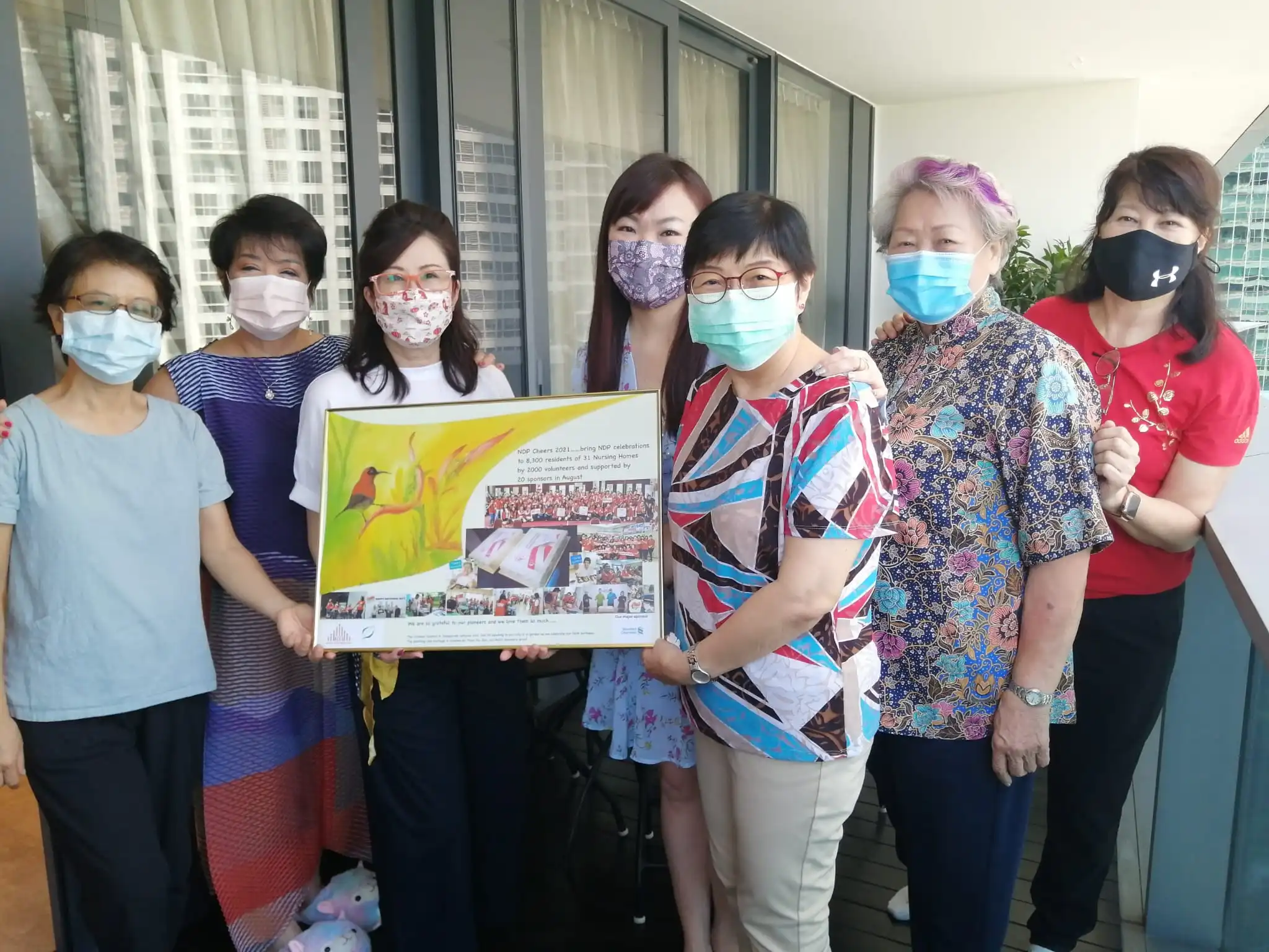 Dr Tan Bee Wan and Ms Tang Wai San of ACE Seniors presenting a painting to SWA President Lee Li Hua