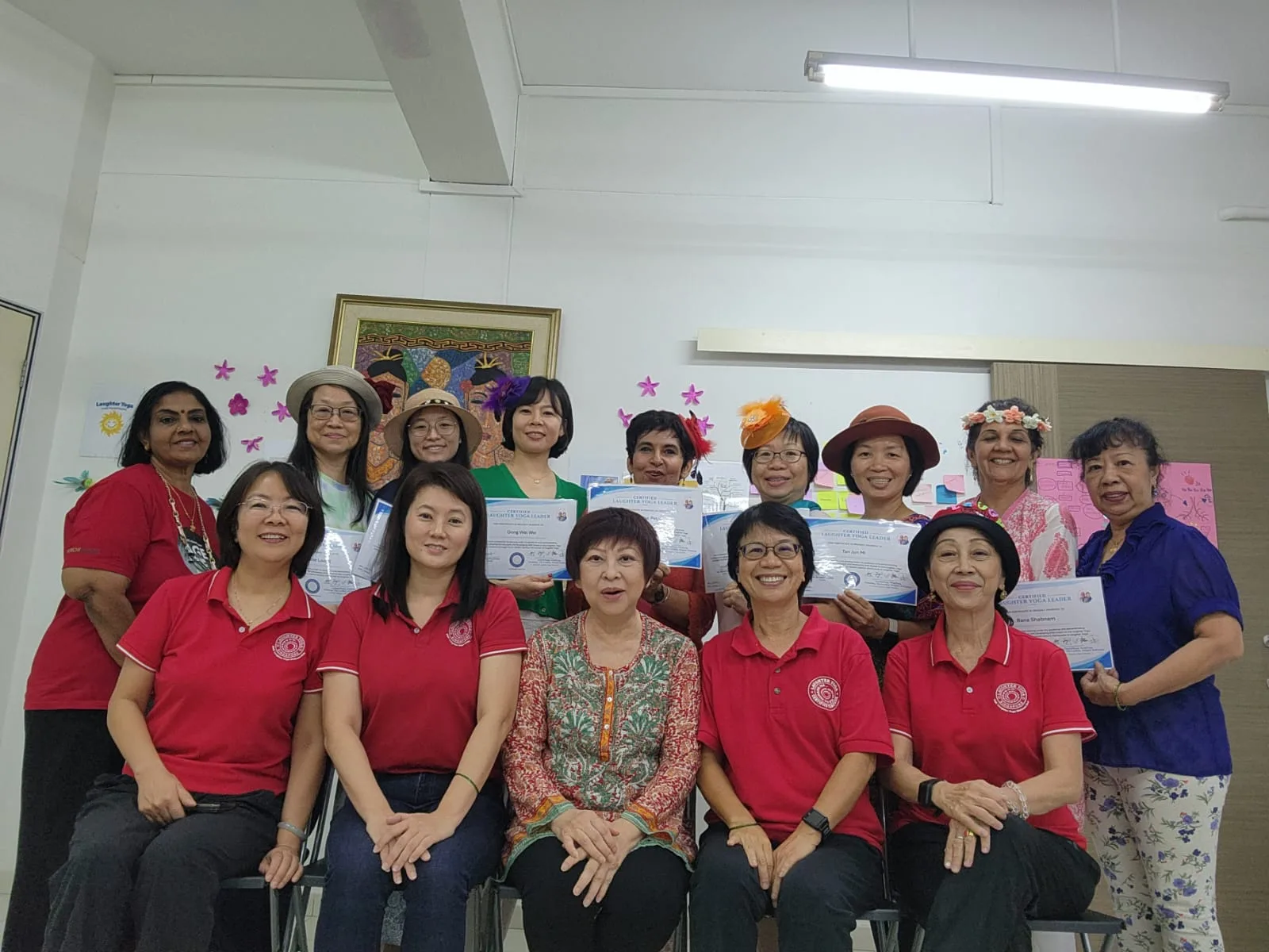 Seven newly certified Laughter Yoga Leaders at their graduation ceremony