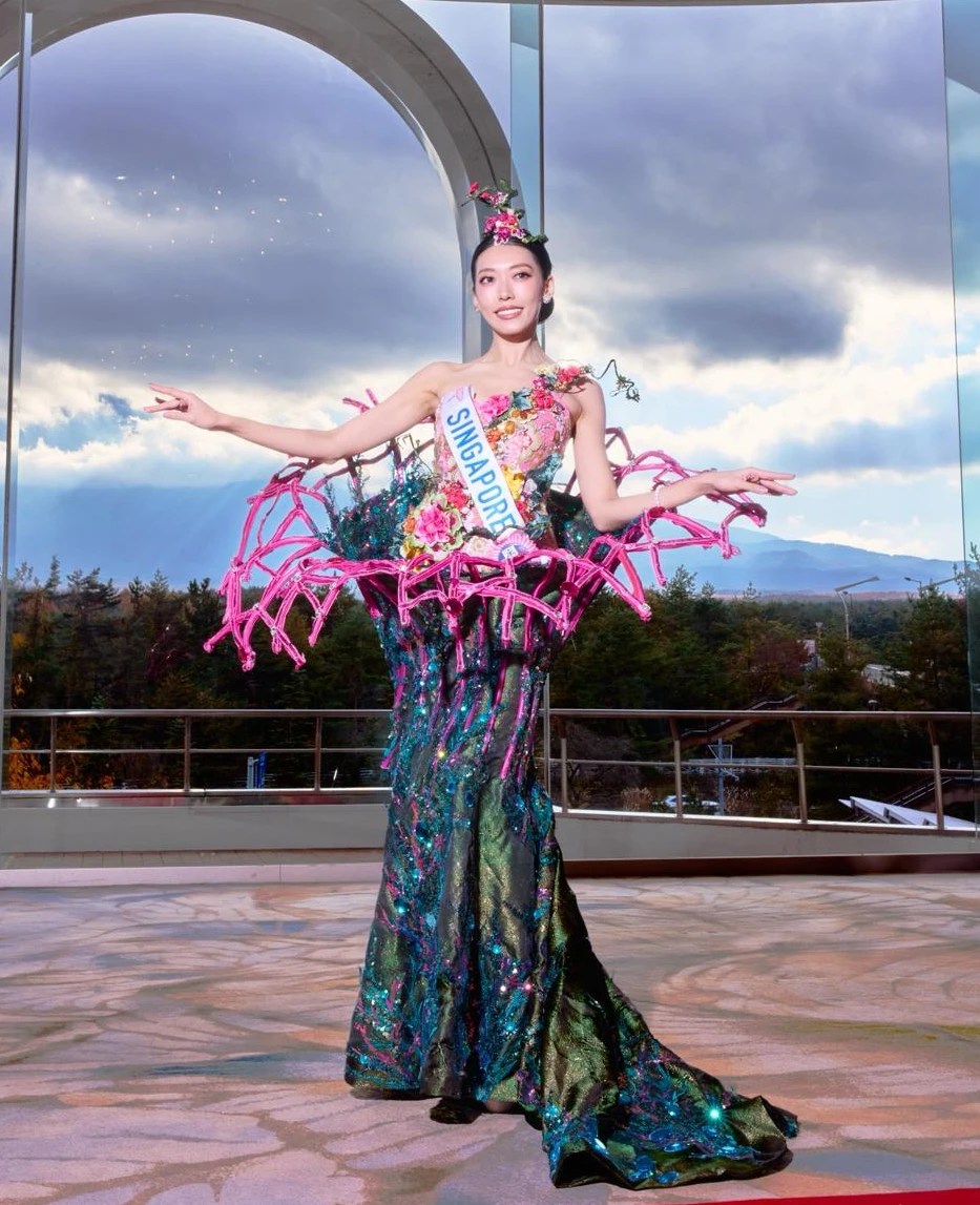 Tanisha Tan showcasing Singapore's Supertree Grove national costume designed by Moe Kasim at Miss International 2025