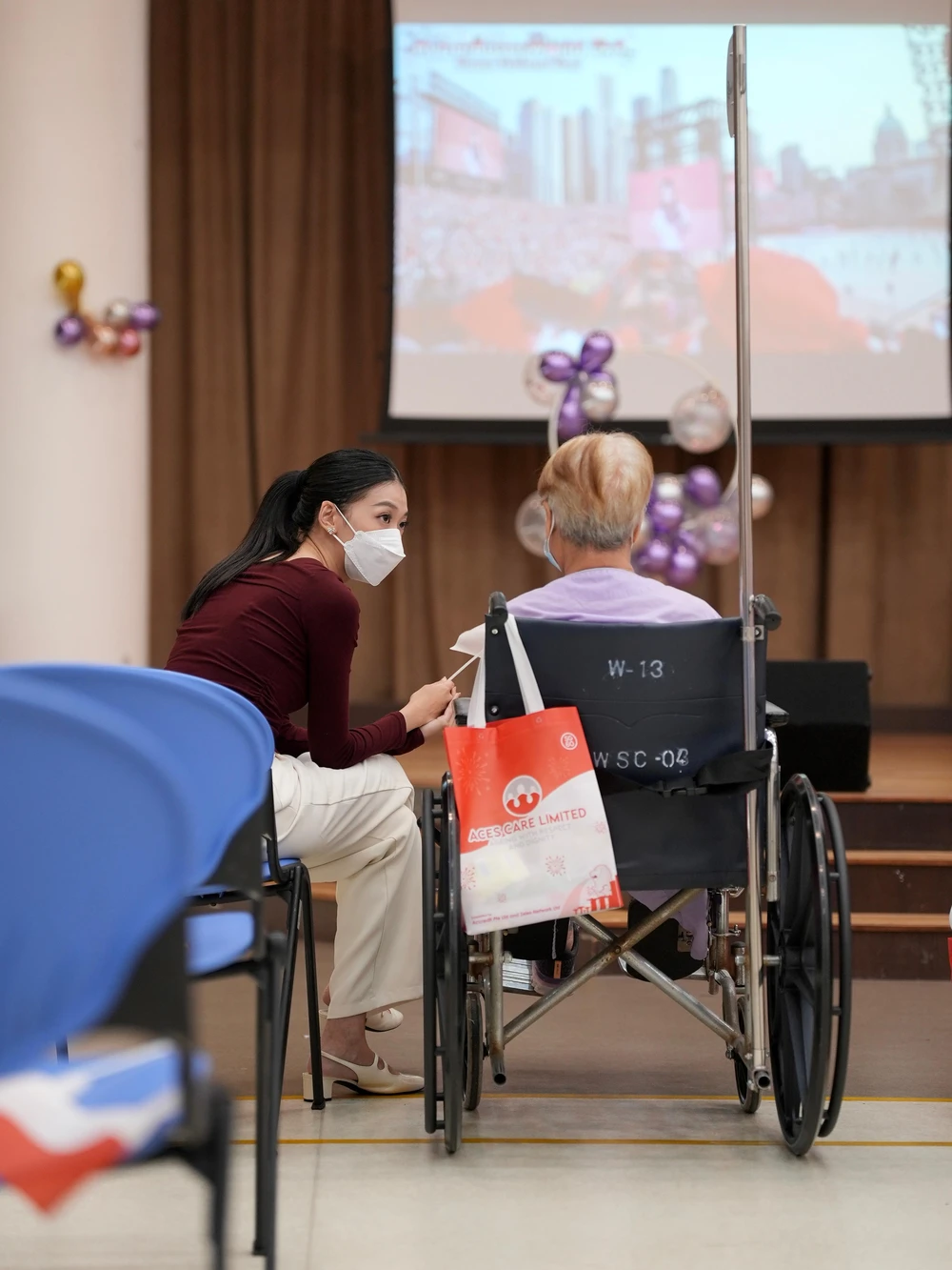 Miss Singapore International Queen Tanisha Tan bringing smiles to residents