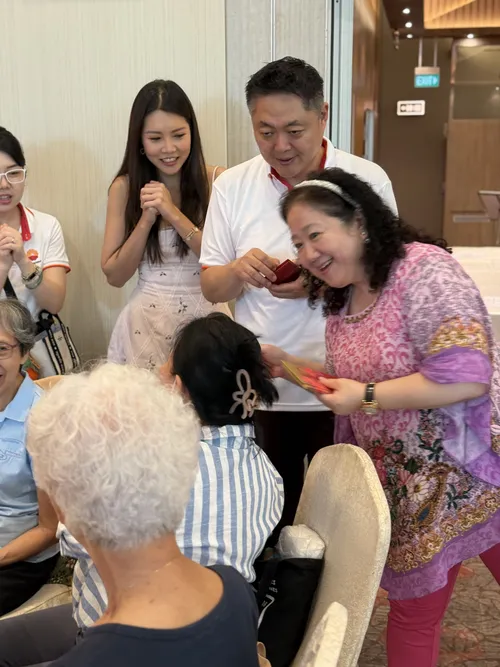 VIPs distributing ang bao to seniors