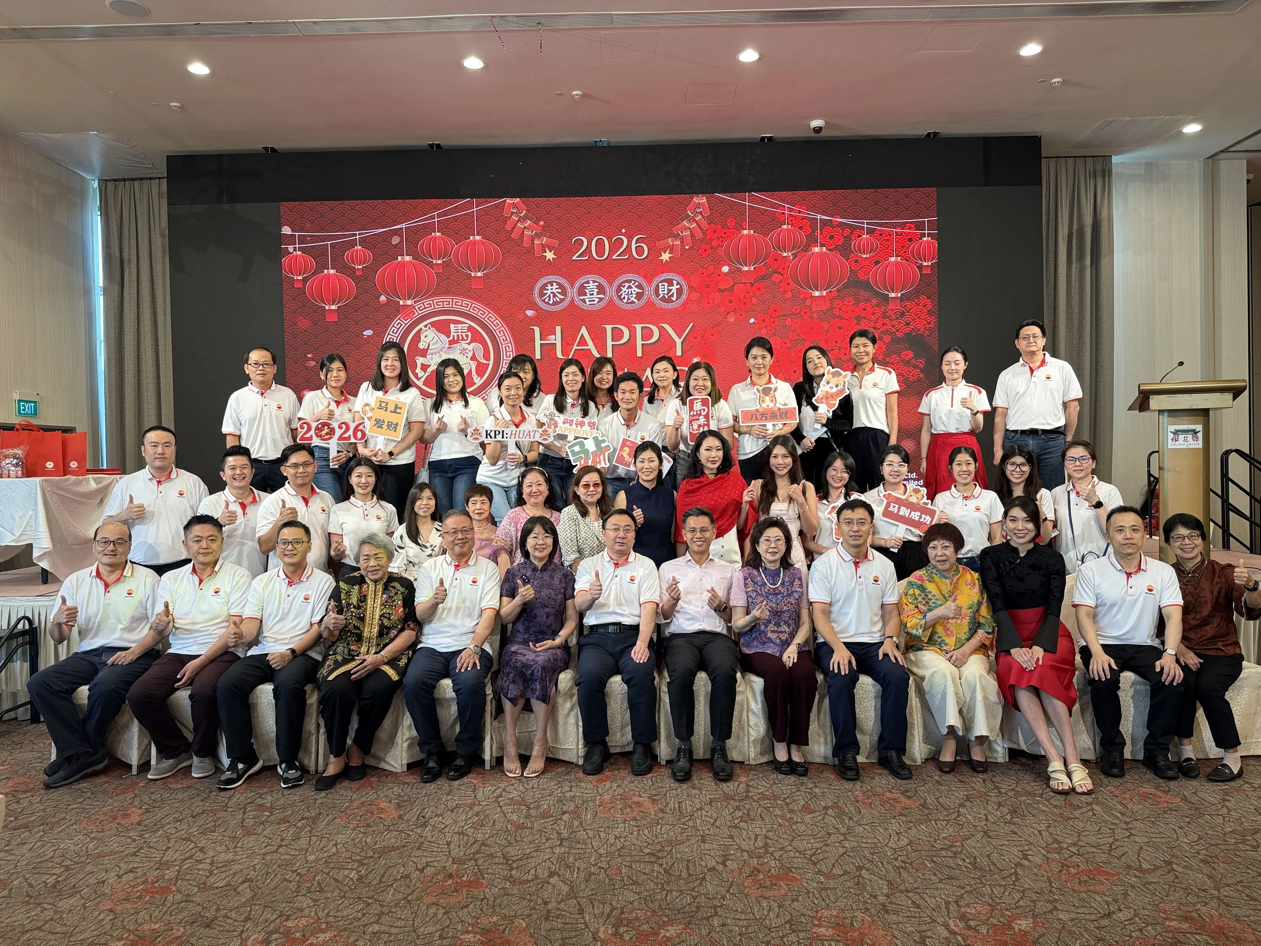 Group photo of VIPs, PCSG volunteers, and SWA members on stage