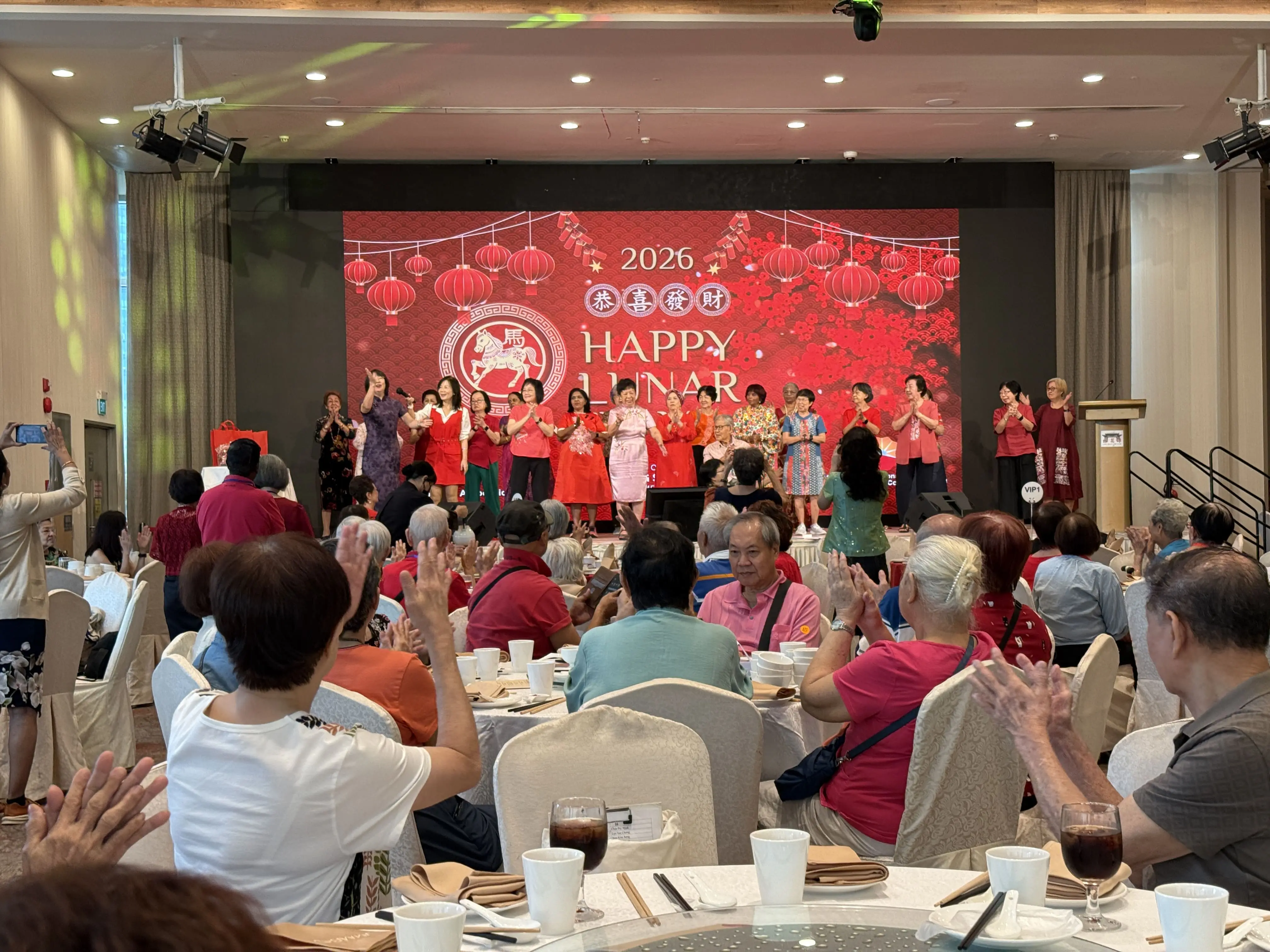 Seniors singing together at the celebration