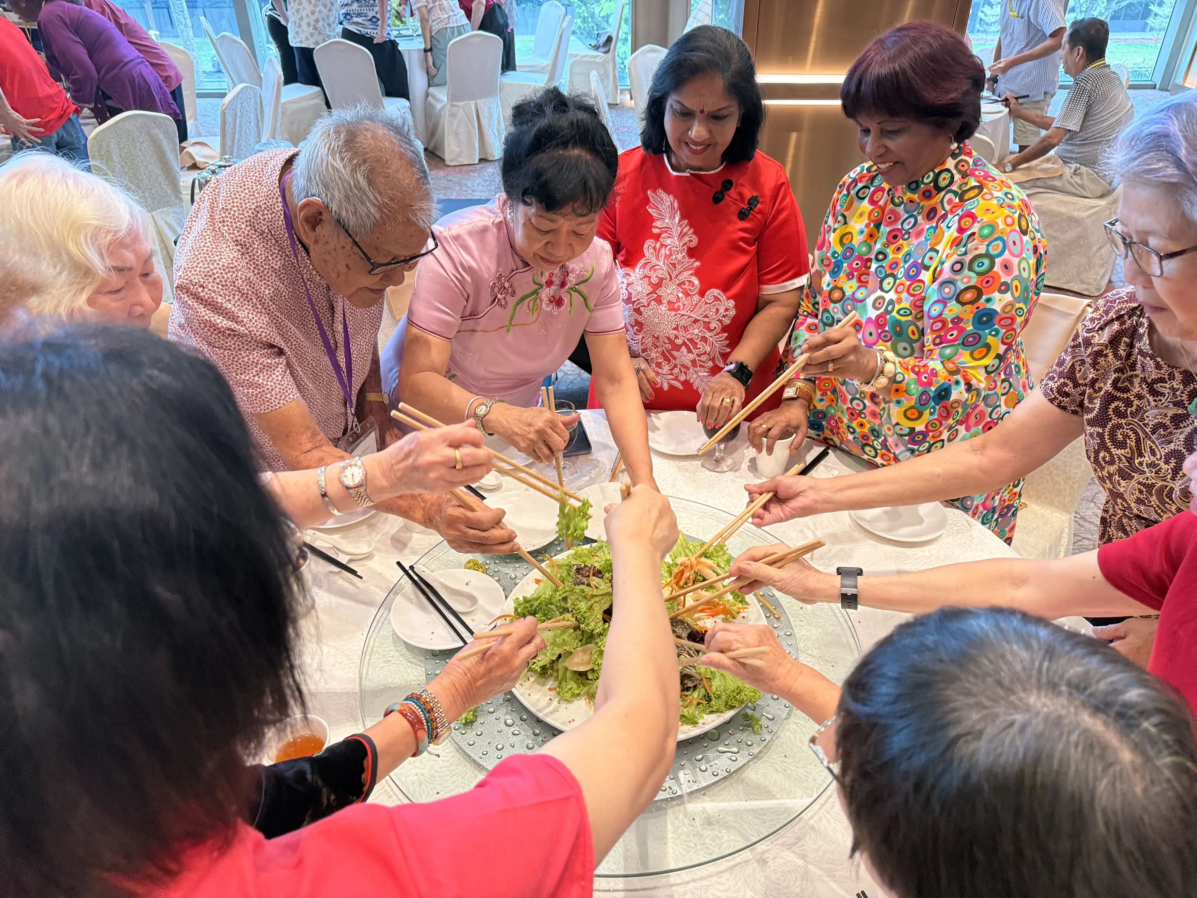 Seniors and VIPs tossing Lo-Hei for prosperity