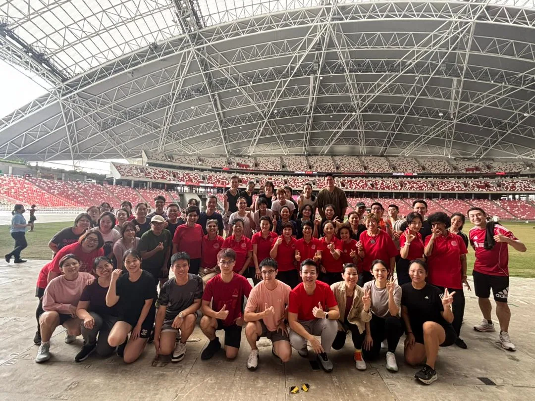 Large group of participants at The Kallang National Stadium Open House Laughter Yoga session