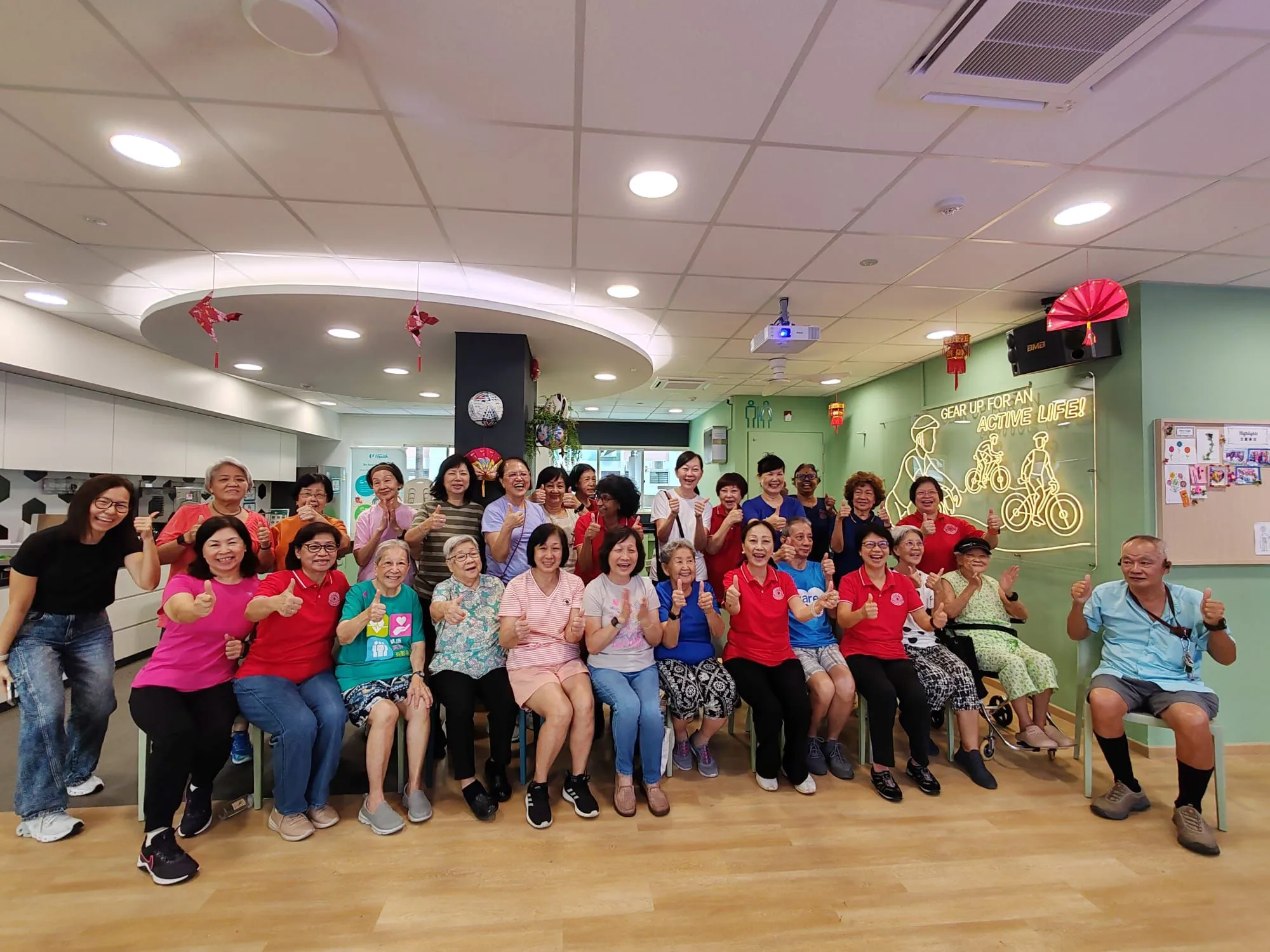 Group photo of seniors and volunteers after the session