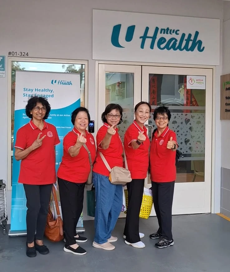 SWA Laughter Yoga volunteers outside NTUC Health Active Ageing Centre