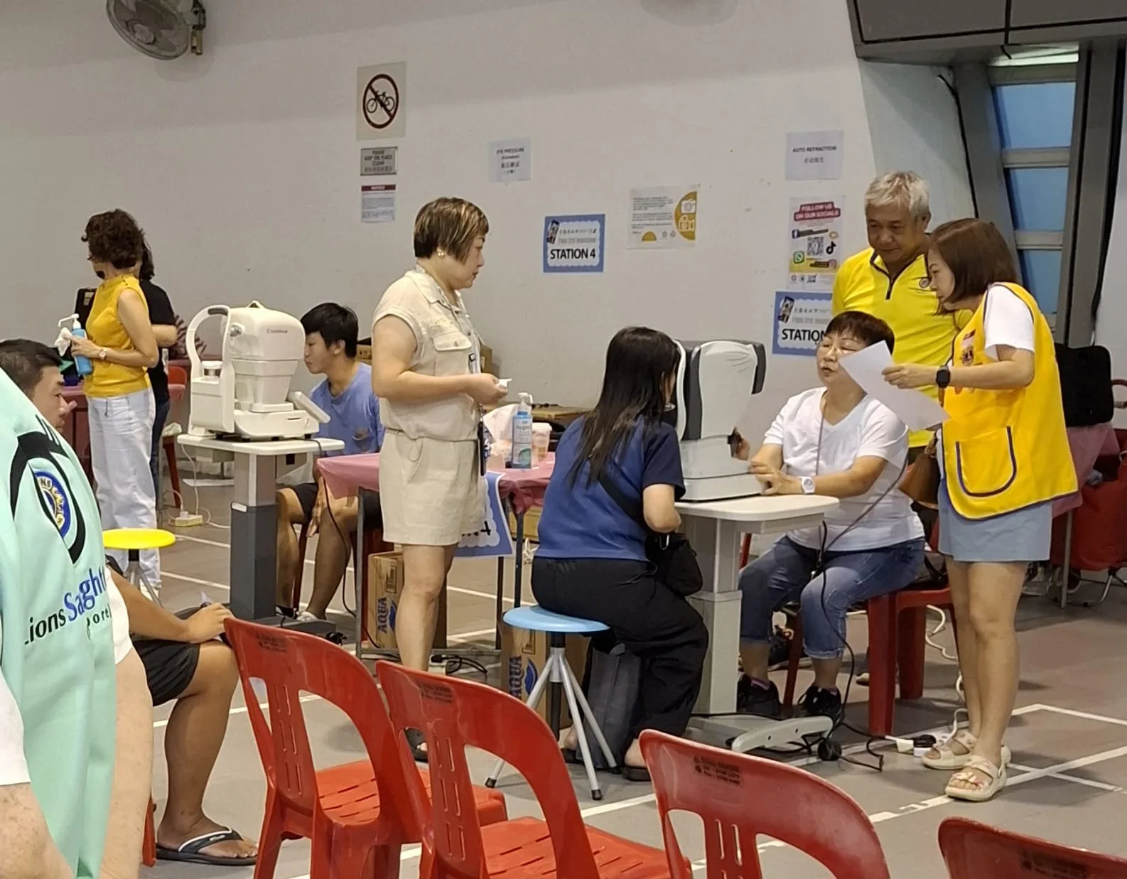 Screening stations with volunteers at Chua Chu Kang Community Club